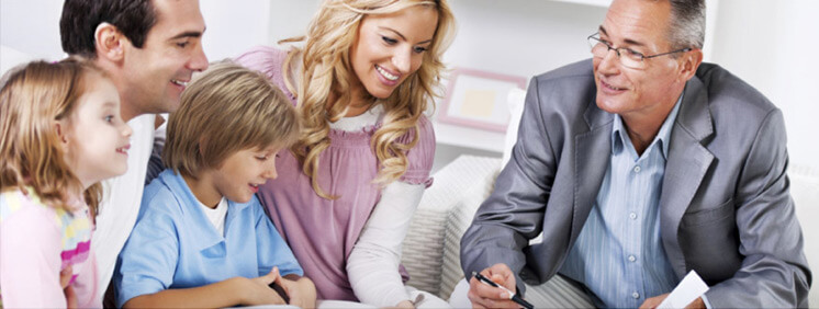 Young couple with children meeting with  Insurance Agent.